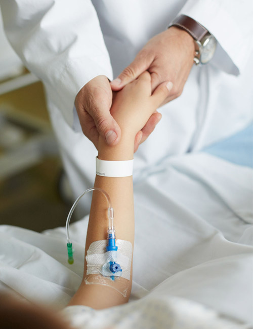 Doctor holding the hand of a patient with AKI