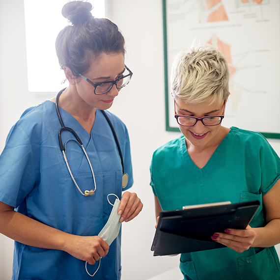 Nurse and Physician looking at chart